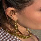 boucles d'oreilles maximalistes et circulaires